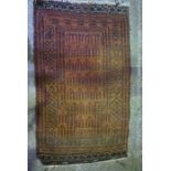 Persian Bluch Hand Knotted Rug, Decorated with Geometric panels on a Rust Ground, 163cm x 92cm