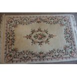 Chinese Style Rug, Decorated with Floral panels on a Cream ground, 203cm x 127cm