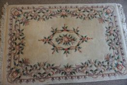 Chinese Style Rug, Decorated with Floral panels on a Cream ground, 203cm x 127cm