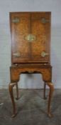 Queen Anne Style Walnut Cocktail Style Cabinet, Having two Doors enclosing a fitted Shelve above a