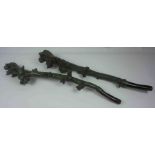 Two Green Painted Shillelaghs, 67cm, 69cm long, (2)