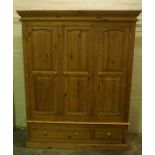 Pine Wardrobe, Having three Doors above two Drawers, 203cm high, 162cm wide, 57cm deep