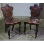 Pair of Victorian Mahogany Hall Chairs, Having a Carved Back Rest, Decorated with Scrolls and a