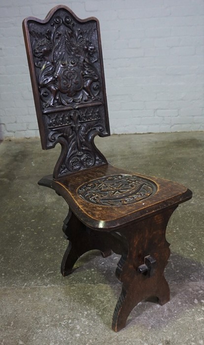 Carved Oak Hall Chair, circa 19th century, The Back Rest is carved with Griffins, Armorial Carved