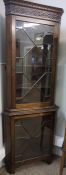 Mahogany Corner Cabinet, circa early 20th century, The two section Cabinet having two Glazed