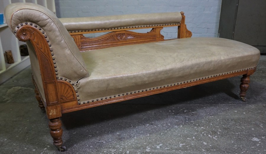 Oak Chaise Longue, circa early 20th century, Upholstered in later Rexine, Raised on Castors, 74cm