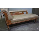 Oak Chaise Longue, circa early 20th century, Upholstered in later Rexine, Raised on Castors, 74cm