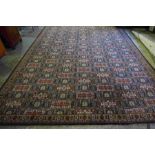 Wilton Carpet, Decorated with allover Geometric Medallions on a Red, White and Blue Ground, 370cm