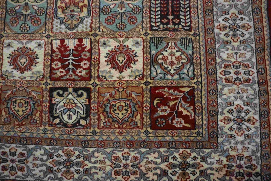 Indian Kashmir Rug, Decorated with ten rows of five Floral and Geometric Medallions on a Red ground, - Image 2 of 3