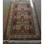 Indian Kashmir Rug, Decorated with ten rows of five Floral and Geometric Medallions on a Red ground,