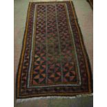 Afghan Bluch Rug, Decorated with allover Geometric Medallions on a Red, Black and Orange Ground,