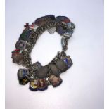 Silver and Enamel Charm Bracelet, Gross weight 91.1 Grams