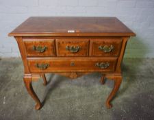 Georgian Style Lowboy, 20th century, Having three small Drawers above a Long Drawer, Raised on Pad