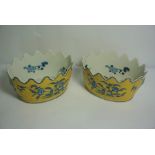 Pair of Chinese Pottery Planters, Decorated with Blue Foliate Panels and Masks on a Yellow Ground,