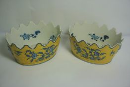 Pair of Chinese Pottery Planters, Decorated with Blue Foliate Panels and Masks on a Yellow Ground,