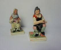 Near Pair of Staffordshire Pearlware Figures, circa early 19th century, Modelled as a Cobbler and