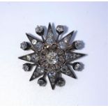 Victorian Ray Star Diamond Brooch, Set with old round Brilliant cut Diamonds, Mounted in Silver on
