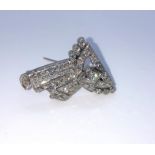 Art Deco Diamond Brooch, Of scrolling Ribbon form, Set with a single and round Brilliant cut
