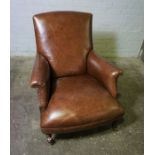 Tetrad Brown Leather Library Armchair, Raised on Turned Supports with Brass Castors, Label to