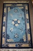 Three Chinese Style Rugs, Decorated with Floral Medallions on a Pale Blue Ground, 110cm x 64cm,