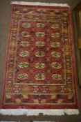 Pair of Persian Rugs, Decorated with six rows of three Geometric Medallions on a Red Ground, 160cm x