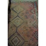 Persian Rug, Decorated with Geometric panels on a Red Ground, 235cm x 140cm