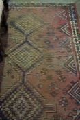 Persian Rug, Decorated with Geometric panels on a Red Ground, 235cm x 140cm