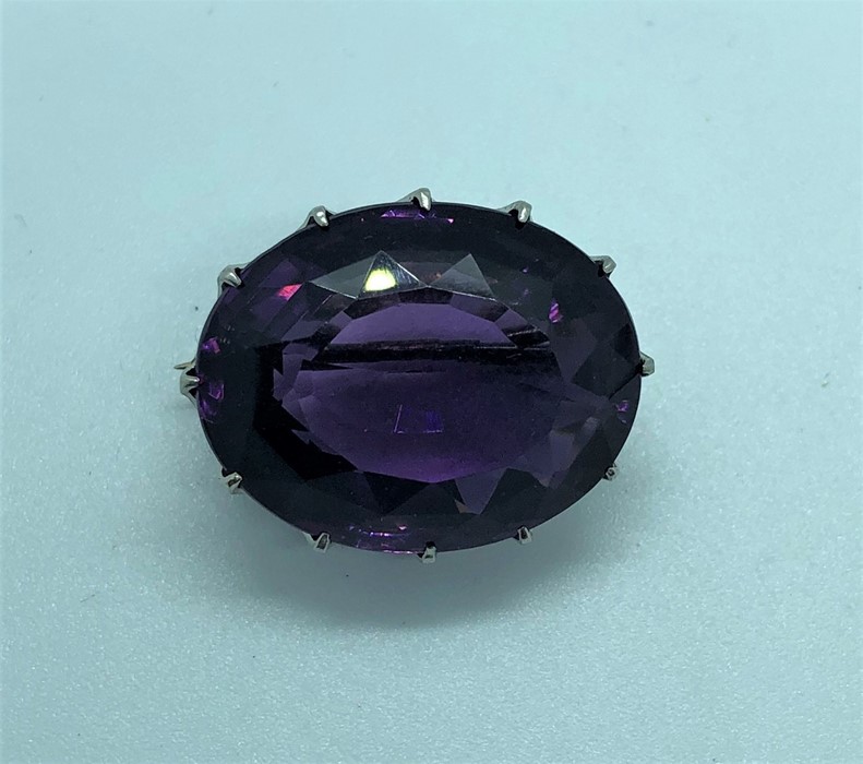 Amethyst Faceted Cut Brooch, Set with an oval Amethyst Cabochon, Measuring approximately 20mm,