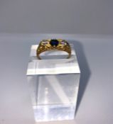 18ct Gold Sapphire and Diamond Ladies Three Stone Ring, Set with a Sapphire to the centre, Flanked