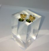 Pair of 18ct Gold Gemstone Earrings, Set with a small Green Gemstone to the centre, Stamped 750,