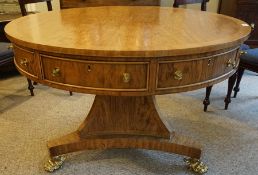 Regency Style Drum Library Table, 20th century, Having Drawers and Faux Drawers, Raised on a Faceted