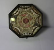 Antique Shell Collage, Enclosed in an Octagonal Stained Pine Display Case, 5cm high, 29.5cm wide