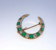 Emerald and Diamond Crescent Brooch, Set with approximately 9 Graduated Brilliant cut Diamonds,