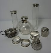 Mixed Lot of Silver, Comprising of five assorted Silver Topped Toilet Bottles, Two Silver Napkin