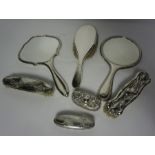 Five Silver Backed Dressing Table Items, circa early 20th century, To include Hand Mirrors and