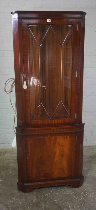 Reproduction Corner Cabinet, Having a Glazed Door enclosing Glass Shelves above a Cupboard door,