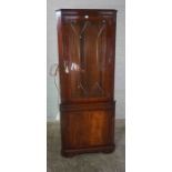 Reproduction Corner Cabinet, Having a Glazed Door enclosing Glass Shelves above a Cupboard door,