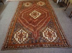 Qashqai Rug, Decorated with Geometric Medallions on a Red ground, 257cm x 161cmCondition reportMinor