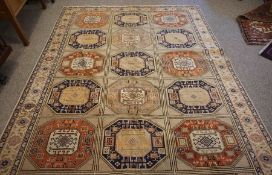 Turkish Herekeh Rug, Decorated with six rows of three Geometric Medallions on a Beige ground,