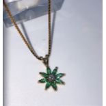 Gemstone and Diamond Ladies Flower Pendant, The Green Pendant is set with small Diamonds, On a 9ct