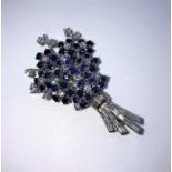 Sapphire and Diamond Spray Brooch, Set with approximately 20 Brilliant cut Diamonds, Measuring
