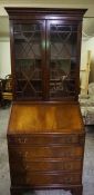 Reproduction Bureau Bookcase, Having two Glazed Astragal Doors above a Fall Front and four Graduated