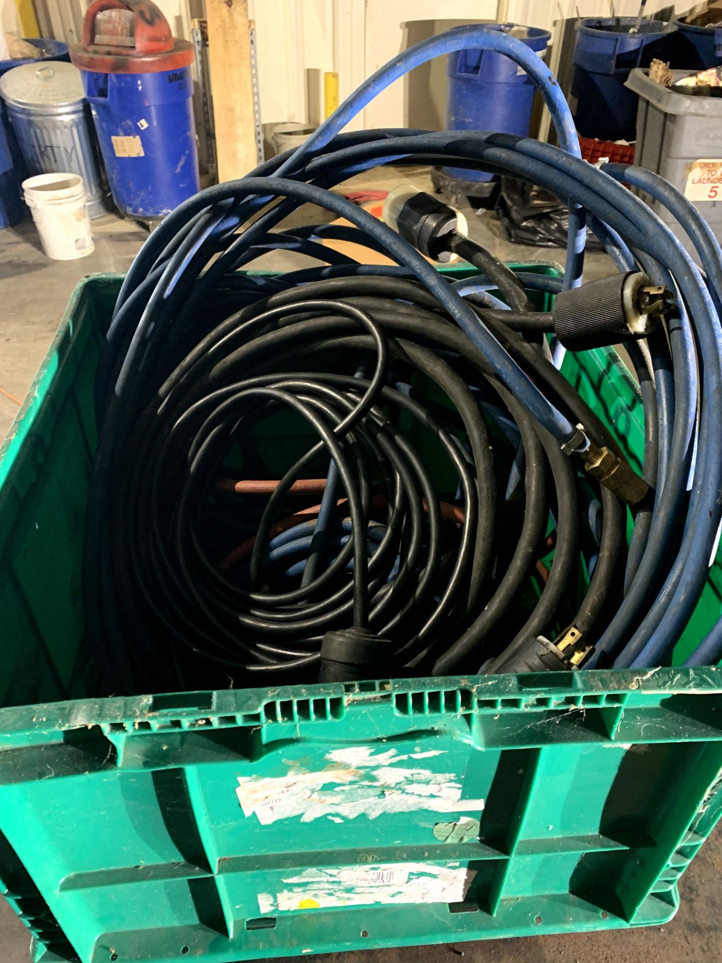 Assorted Red and Blue Water Hoses with Disconnects