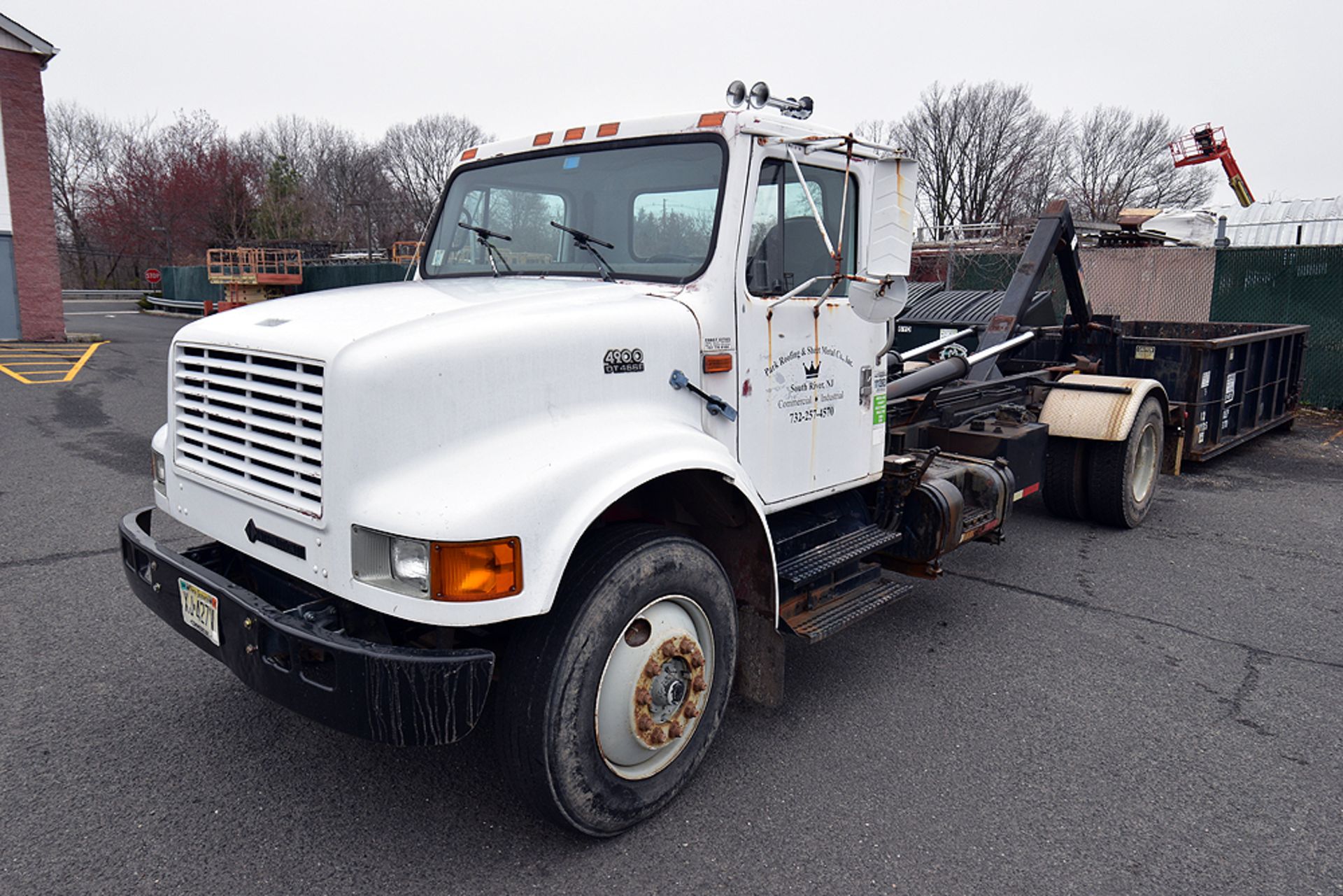 1999 International 4900 Hook-Lift Truck w/ Cont.