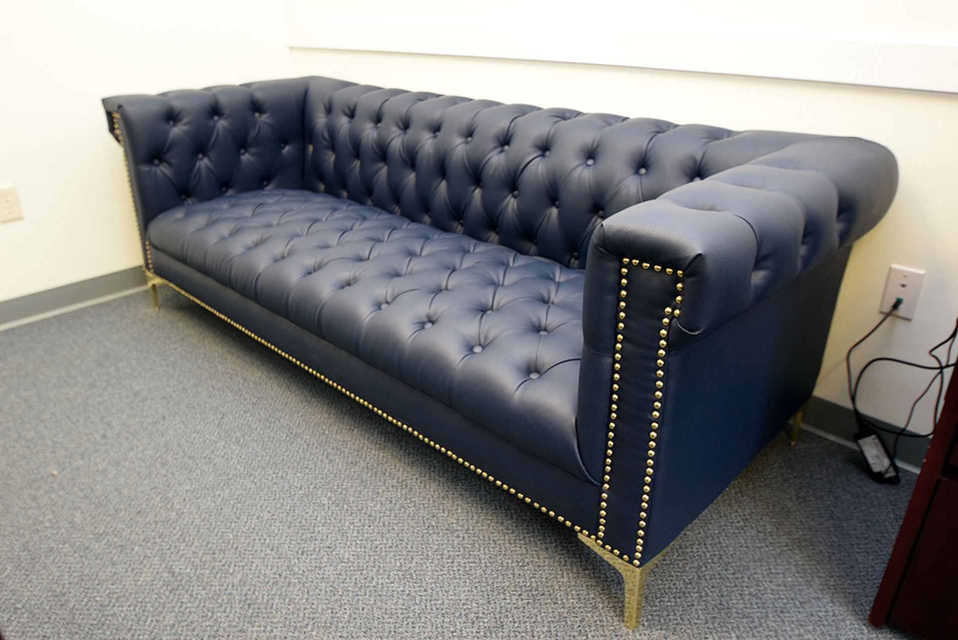Blue Tuffted Faux Leather Sofa (82" L. x 33" W.)