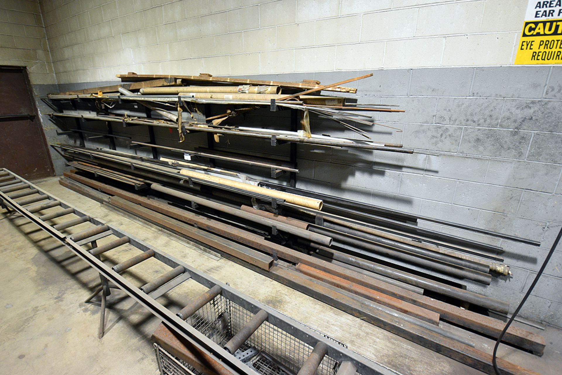 contents of cantilever wall rack containing black pipe, aluminum bar,