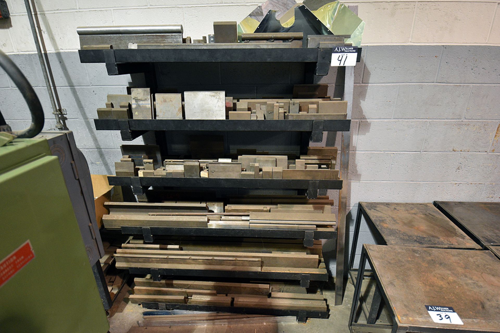 Contents of 6 tier cantilever wall rack containing assorted brake dies