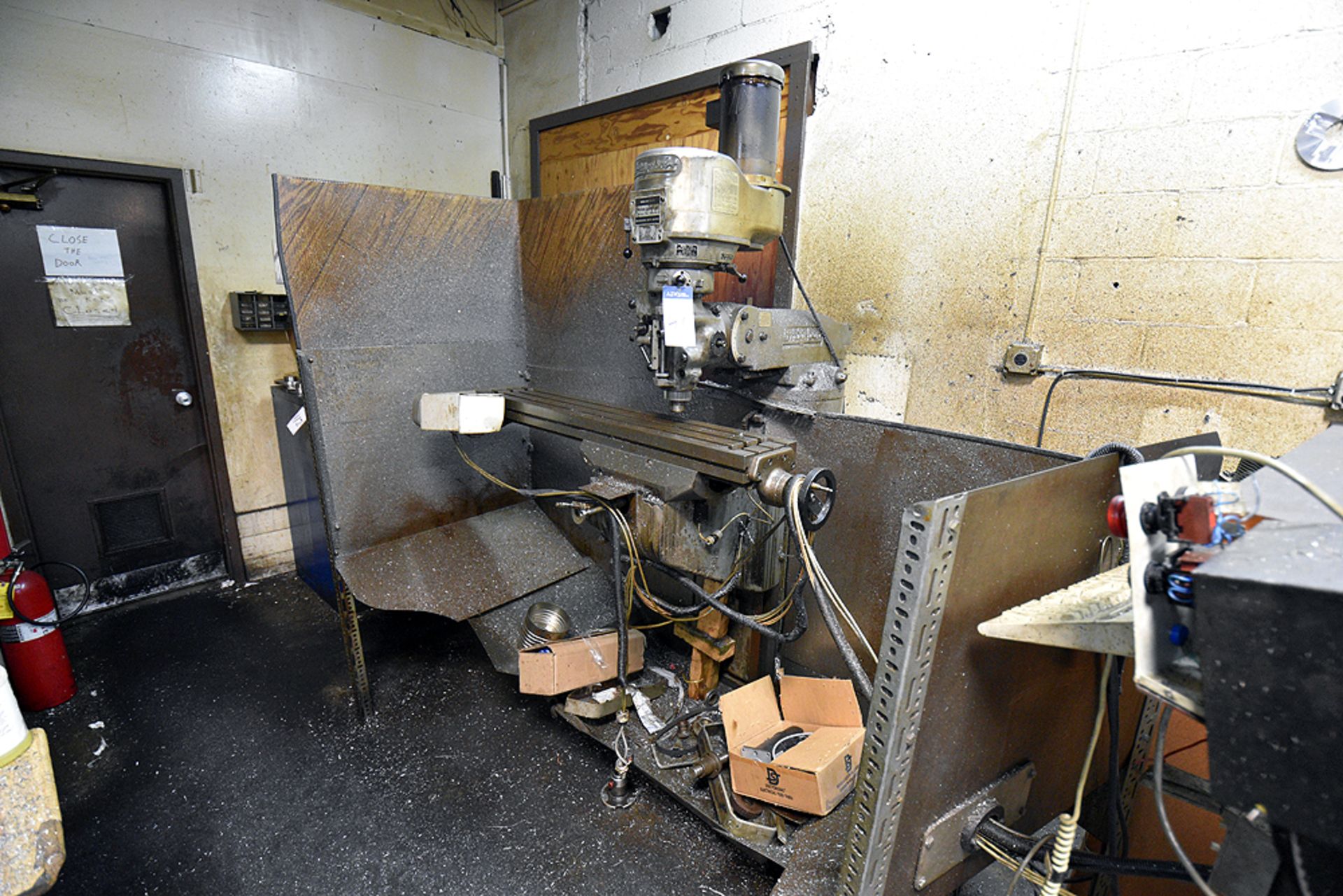 Bridgeport Vertical Milling Machine s/n Not Visible, 2HP Motor, 48" Table, Metal Machine Enclosure