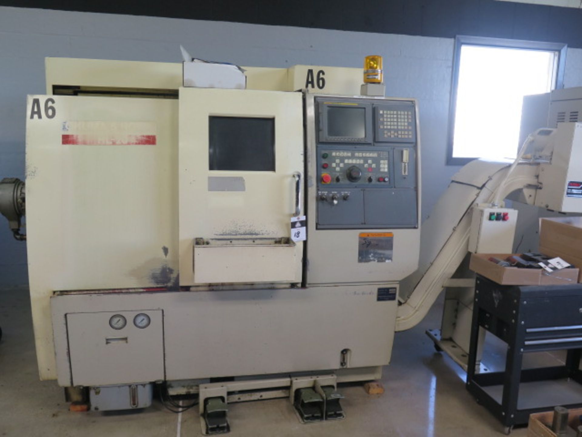 Okuma & Howa HL-20 CNC Turning Center s/n 9035 w/ Fanuc Series 18i-T Controls, 12-Station Turret,