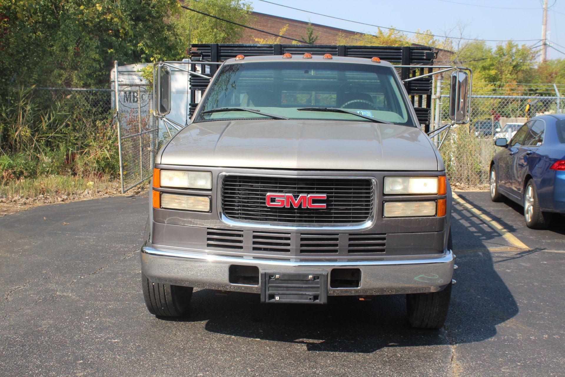 1999 GMC SIERRA 3500 DUALLY STAKE BED TRUCK, 7.4L V-8, VIN 1GDKC34J1XF056858, 109,255 MILES SHOWN ON - Image 2 of 7